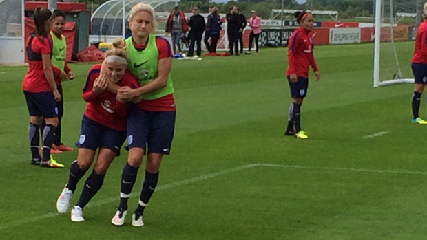 England captain Steph Houghton gets Rachel Daly in a headlock during training