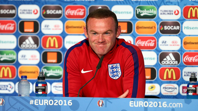 England captain Wayne Rooney speaks to the media in France