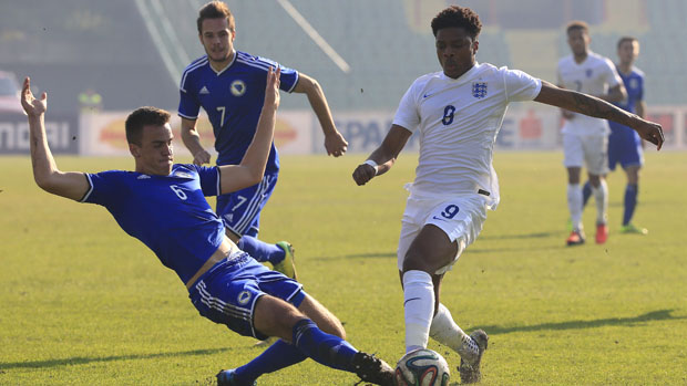 Chuba Akpom and Aleksandar Jovicic compete for possession