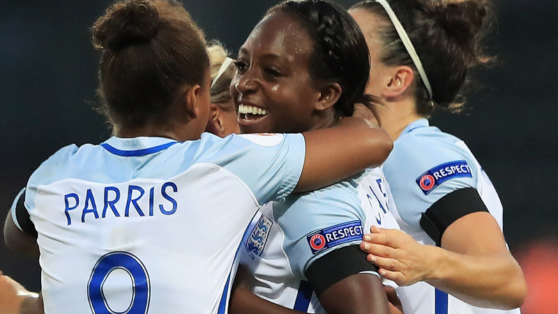 Danielle Carter is congratulated by team-mates after scoring the opener against Estonia