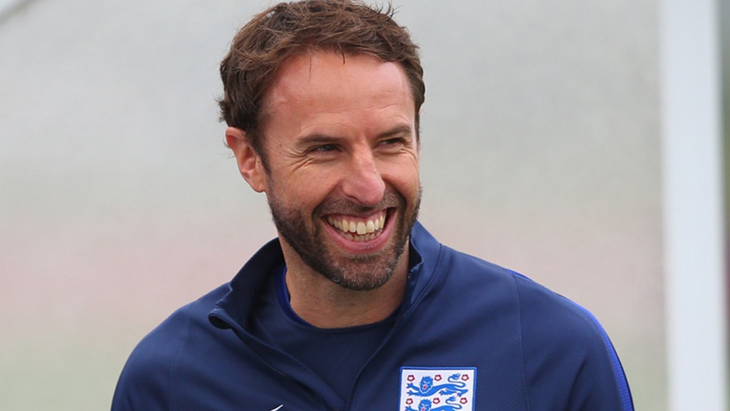 England Under-21s head coach Gareth Southgate smiles during training at St. George