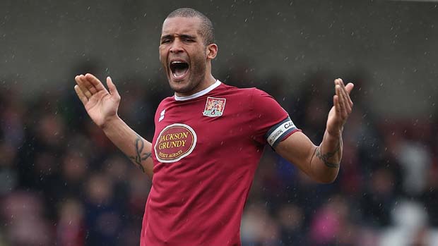 Clarke Carlisle in action for Northampton Town in 2013.