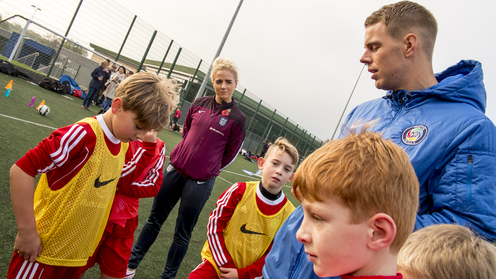 Alex Greenwood chats with kids at the University of Derby
