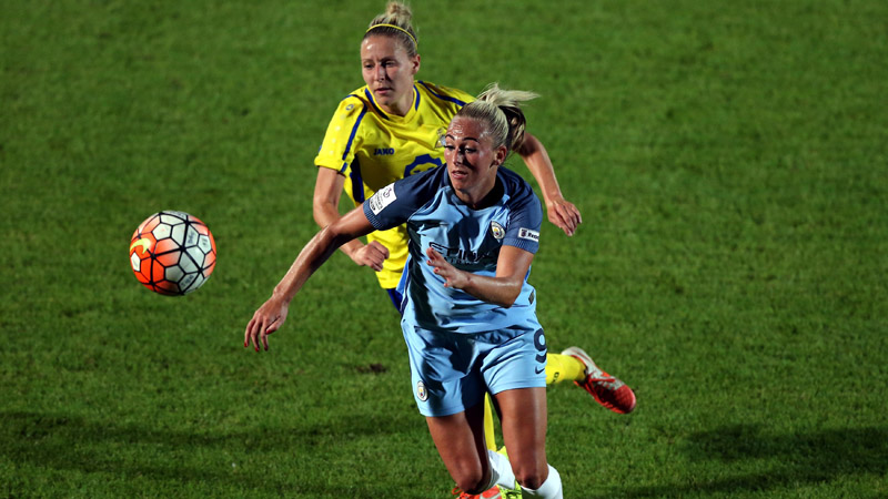 Katrin Omarsdottir (l) of Doncaster Rovers Belles challenges Toni Duggan of Manchester City